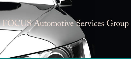 Shiny car bonnet with text reading "focus automatic services group"