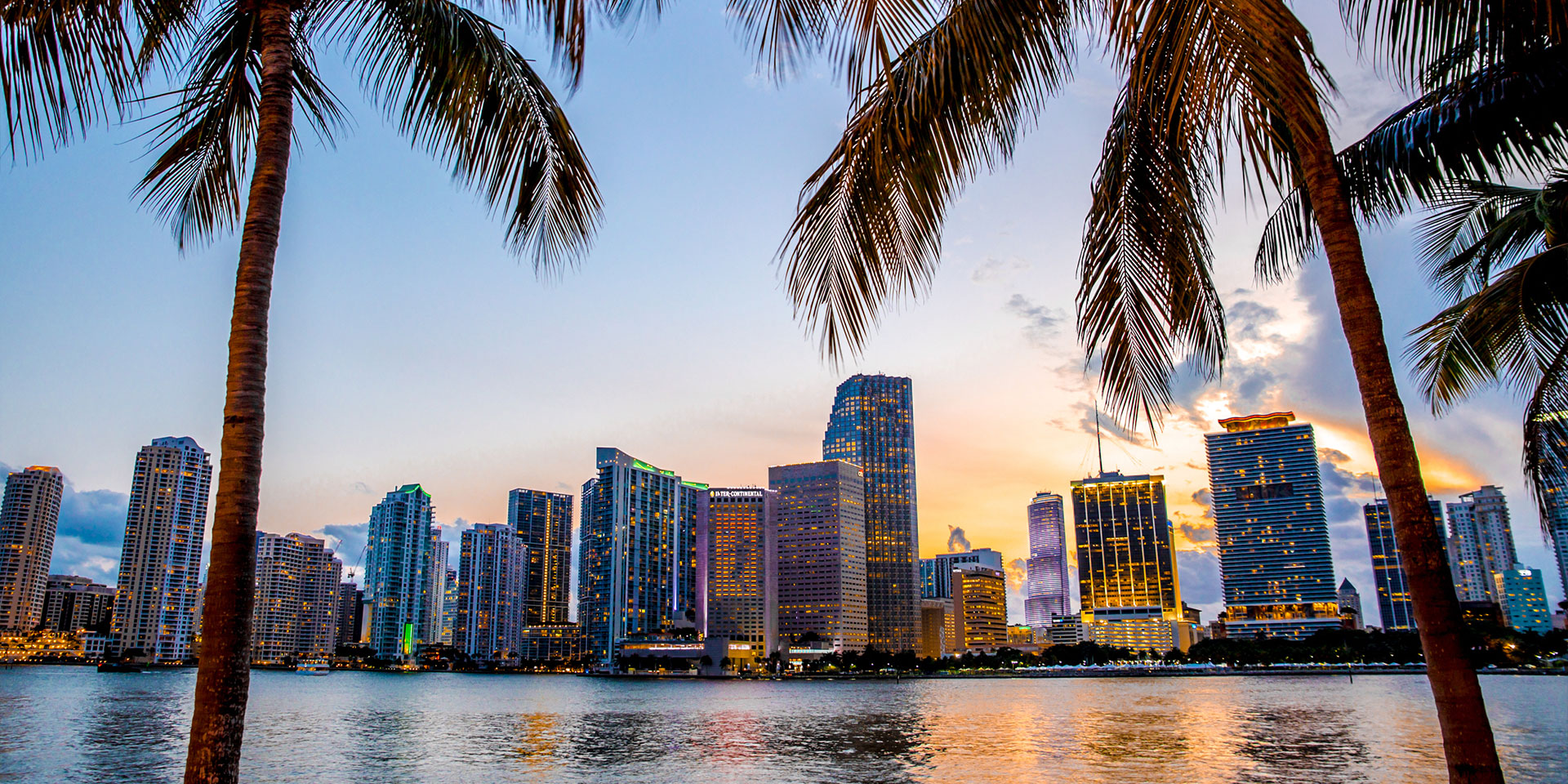 a panoramic picture of miami's coastline at sunset